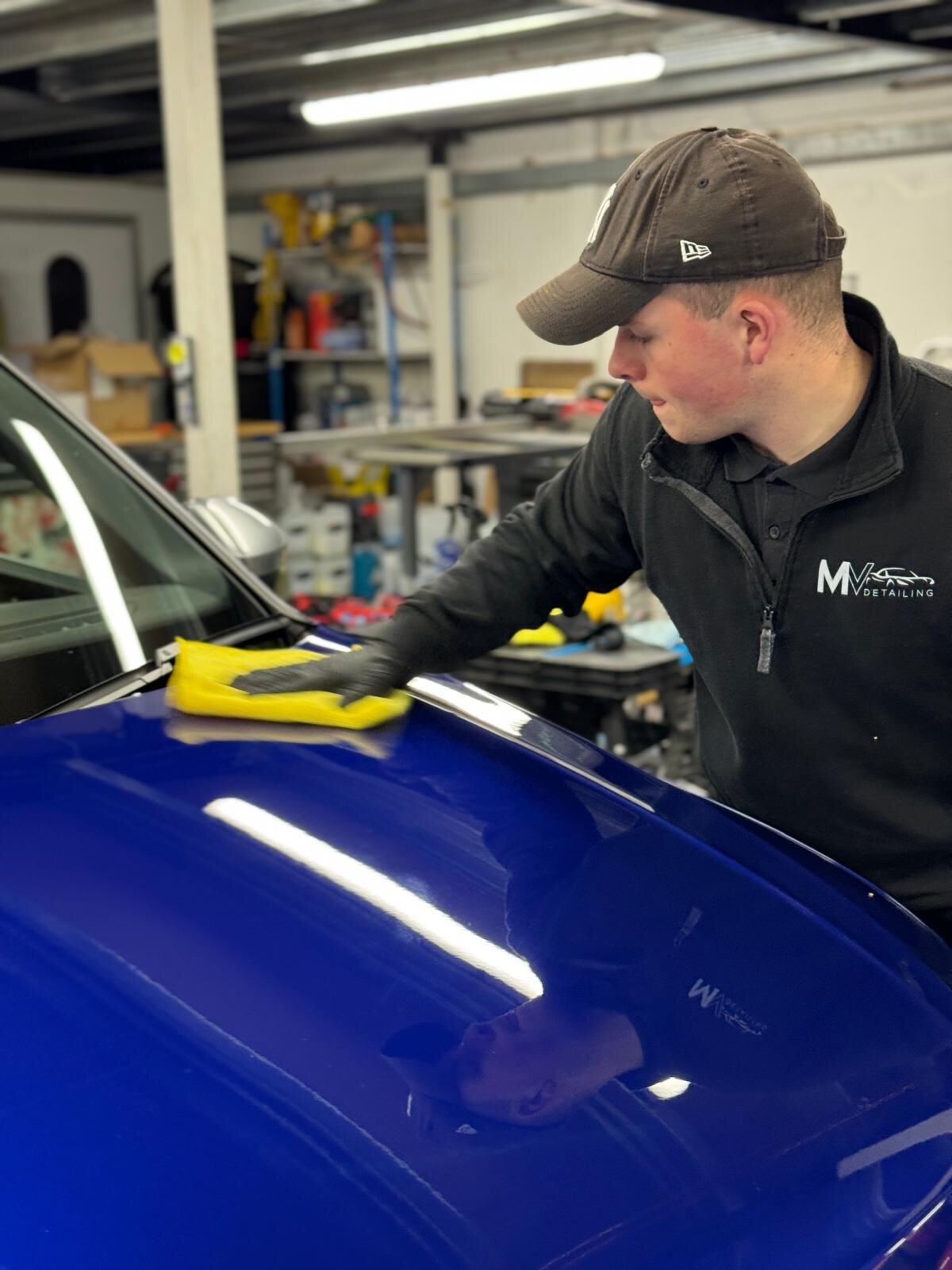 Max, owner of MV Detailing, finishing paintwork by hand at a job in the West Midlands